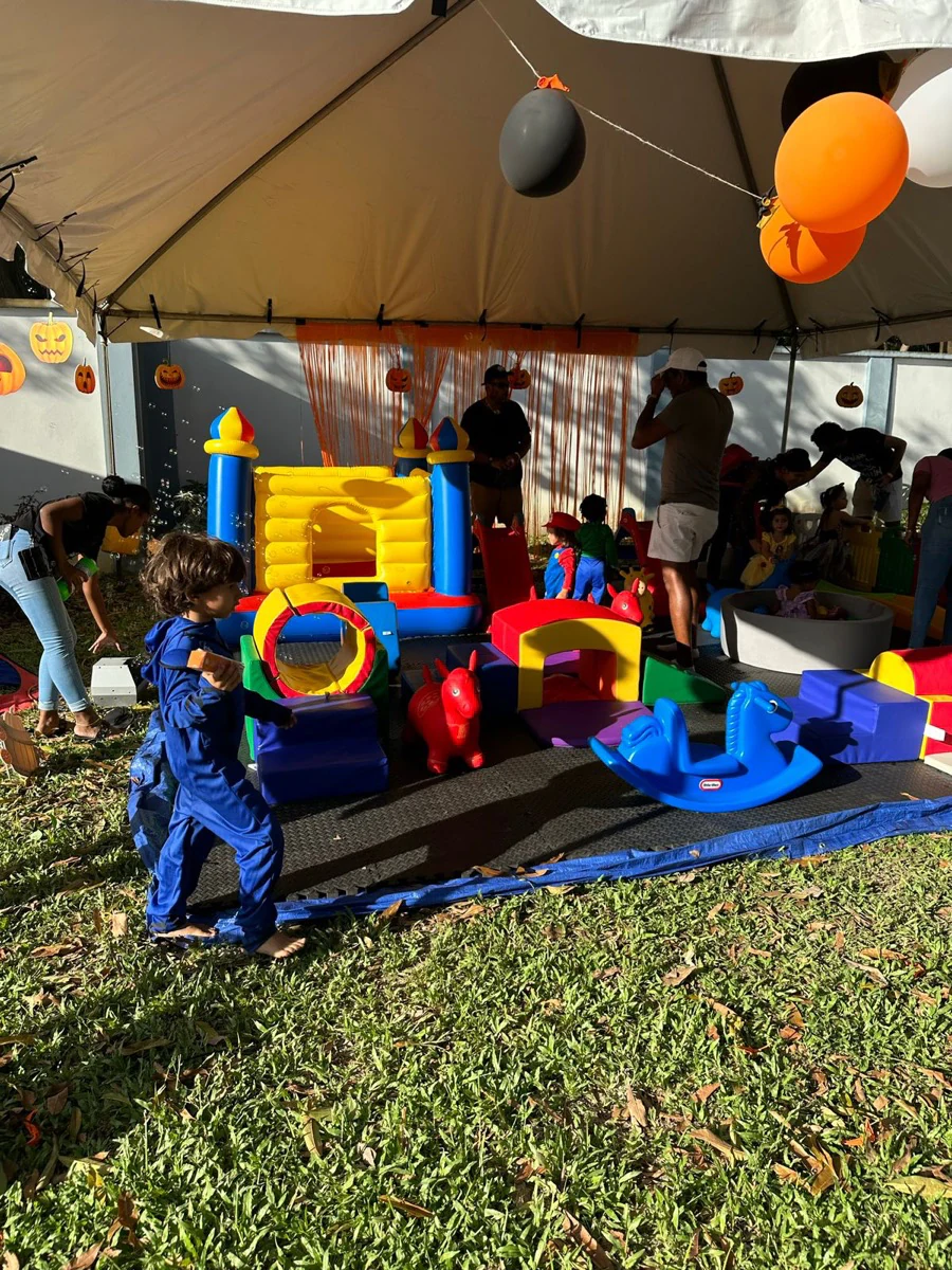 Children exploring a colourful outdoor play zone