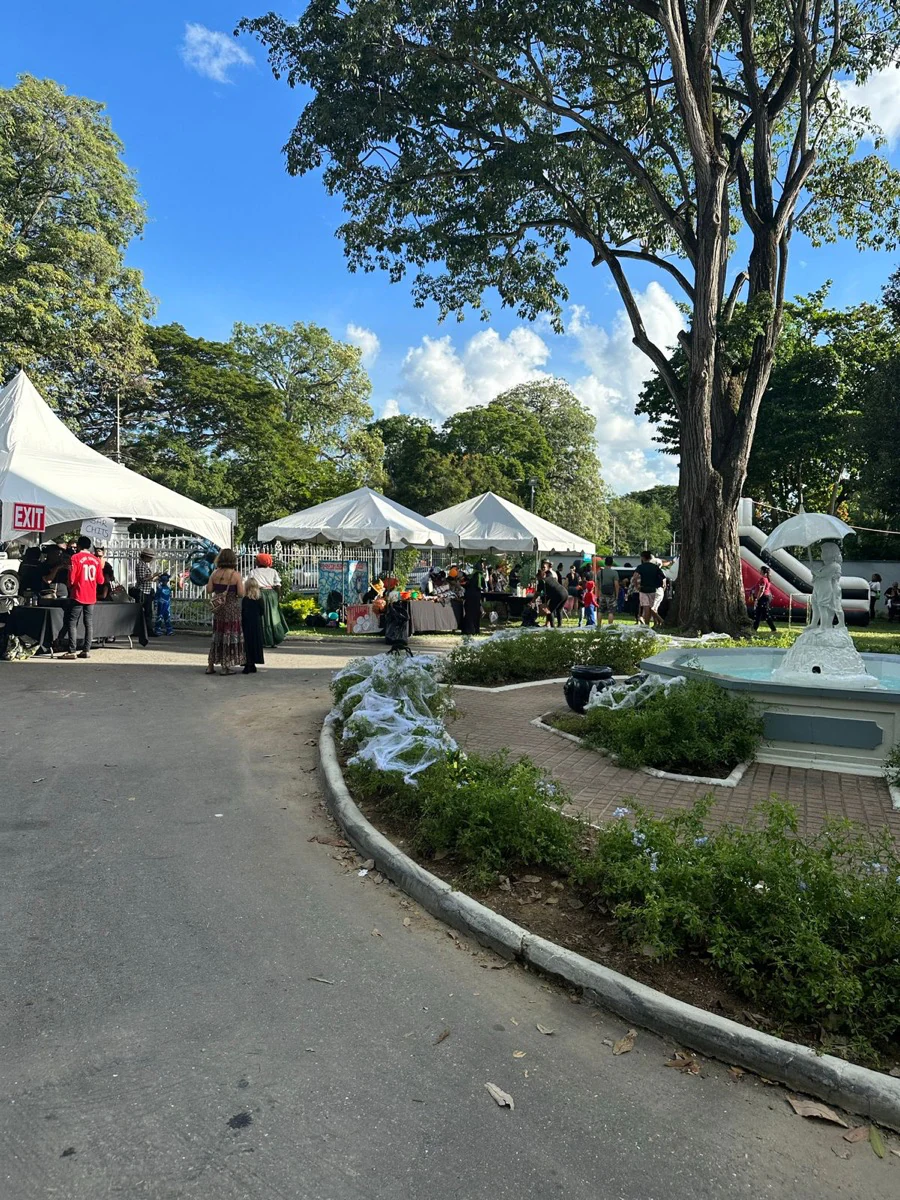 Families gathering around the event garden and activity tents
