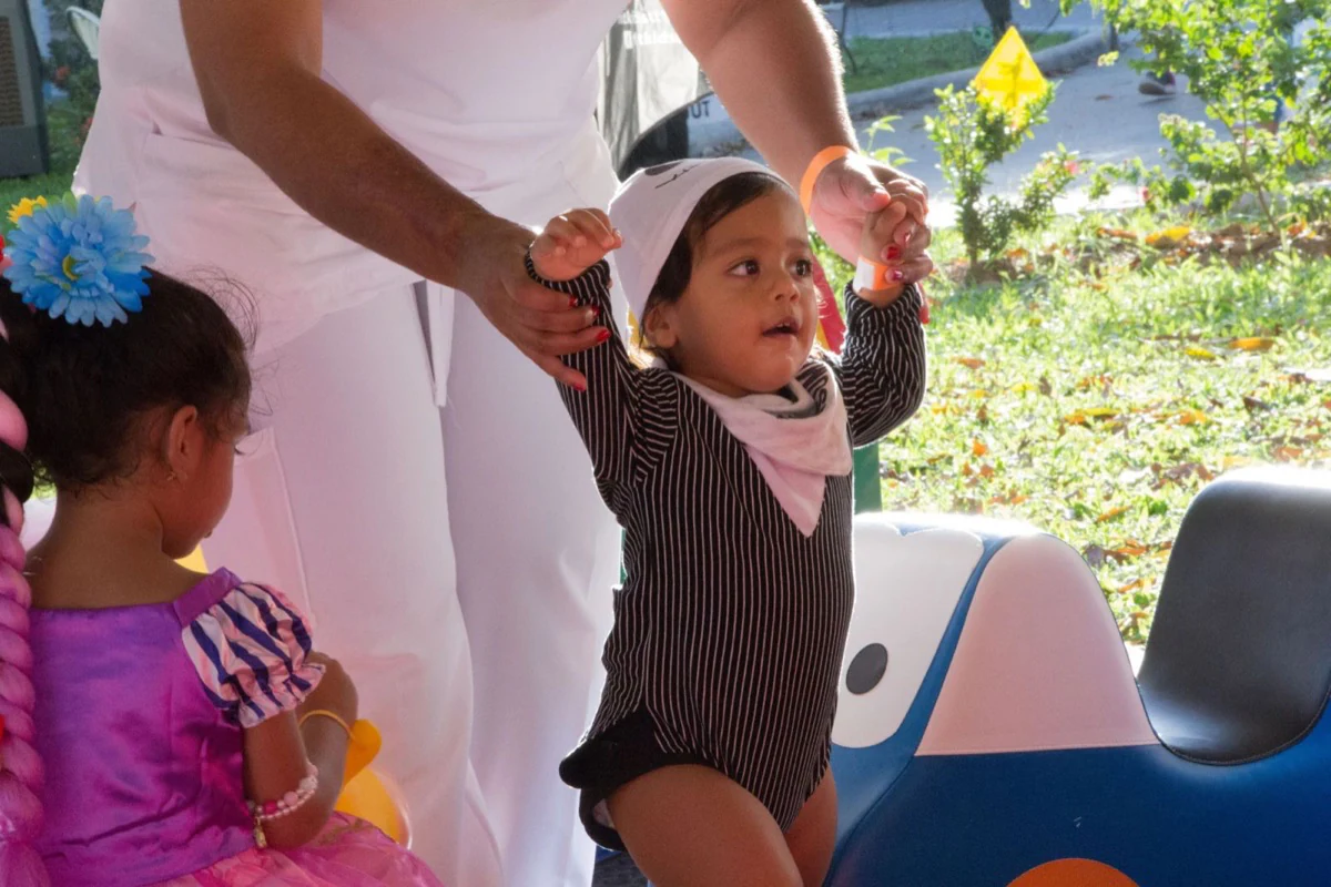 A toddler enjoying the outdoor costume celebration