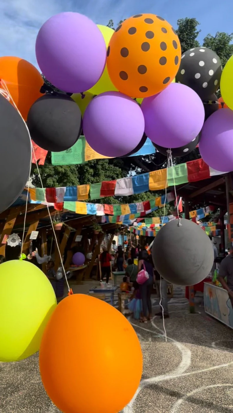 Colourful balloons welcoming families to a Little Steps Caribbean event